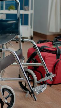 Close up of wheelchair in nursing home room for assistance and transportation support. Empty room with chair used for stationary patients receiving medical care and recovery service