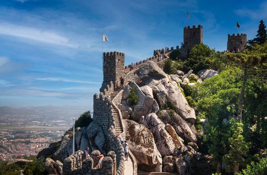 View of the wall and towers of the ruins of the Castelo do Mouros (Moorish Castle) in the Portuguese town of Sintra.