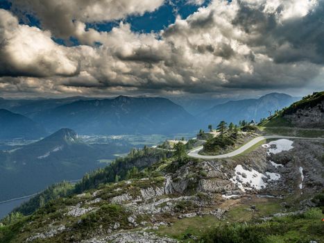 A view of a beautiful mountain landscape with a beautiful panoramic road in the Alps.