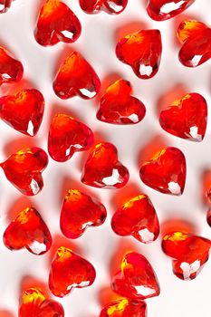 Directly Above Studio Full Frame Image of Sparkling Red Faux Gemstone Hearts on a White Studio Background.