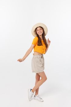 Cool hipster portrait of young stylish teen girl showing her hands up, positive mood and emotions,travel alone. Isolated over grey background.