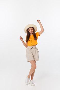 Cool hipster portrait of young stylish teen girl showing her hands up, positive mood and emotions,travel alone. Isolated over grey background.
