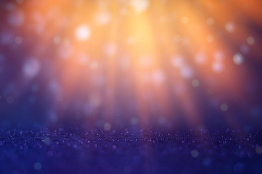 The background is blue, orange and light shines down to celebrate.