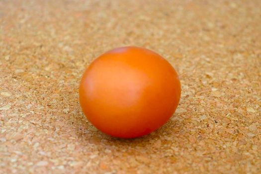 Beautiful yellow egg on the table. A useful product for humans