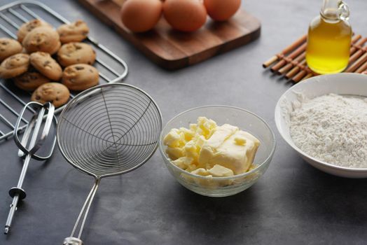 chicken eggs and baking ingredients on a wooden board,