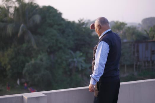 senior man looking away in park .