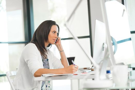 Attractive brunette woman at office desk work on computer