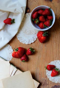 Strawberry on old wooden table, great design for any purposes. Vintage. Wooden background.