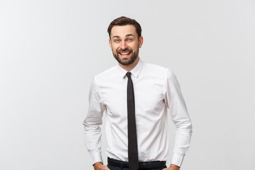 Portrait of young happy smiling business man, isolated over white background.