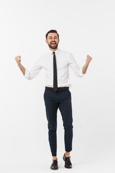 full-length portrait of happy businessman in formal wear with raising hands up. isolated on white background
