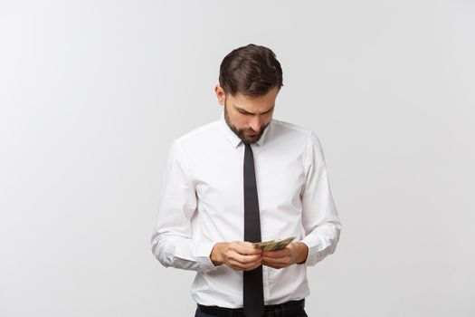 Portrait of a business man holding money, isolated on white