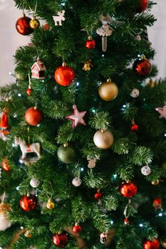 Beautiful Christmas tree decorated with toys and balls. High quality photo