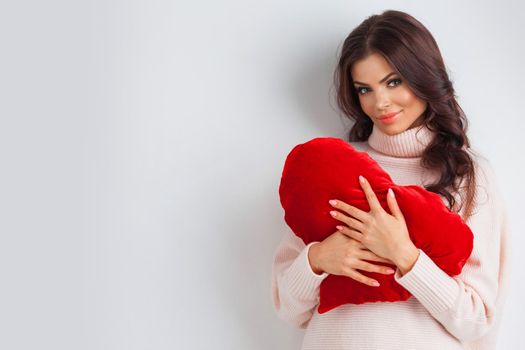 Beautiful woman at home with heart for Valentine's day