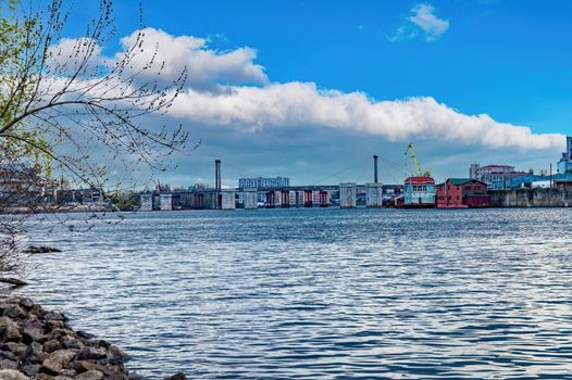 Bridge over the river against the backdrop of the cloudy horizon. Dnepr River. Bridge over the river. Water stream. Cloudy horizon. City landscape. District of the city of Kiev. Ukraine.