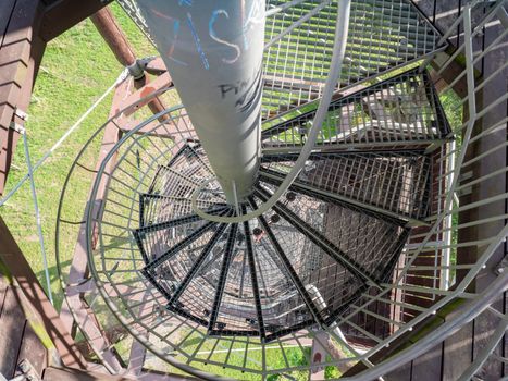 Spiral staircase in tower exterior architecture. Popular landmarks building on hill peak