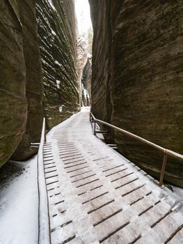 Scenic detail of path in Sandstone rocky labyrinth  in  Adrspach during winter season, Czech republic