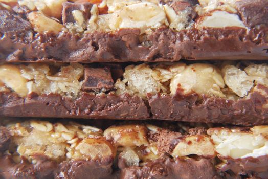 Almond , Raisin and oat protein bars on table .