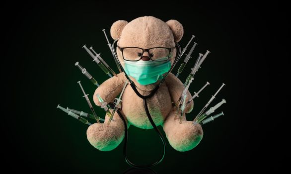 the children's vaccination against the covid19 virus and vaccinations on the example of a teddy bear