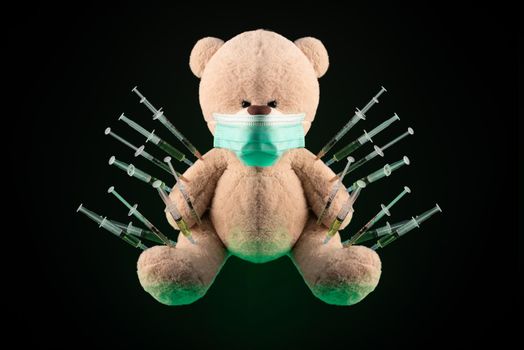 the children's vaccination against the covid19 virus and vaccinations on the example of a teddy bear