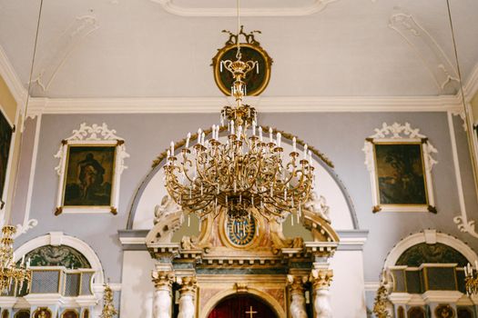 Luxurious chandelier in front of the altar of the Church of the Holy Savior. Dubrovnik, Croatia. High quality photo