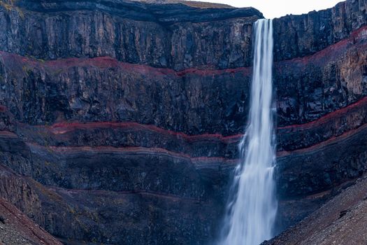Svartifoss waterfall and red layers in Iceland closeup view