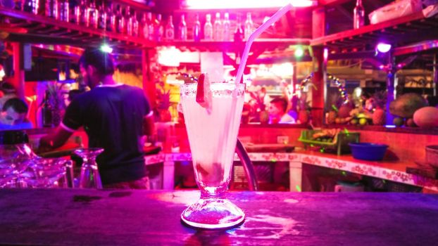 Traditional cocktail daiquiri. decorated with lime at bar background. Background blurred with soft focus. Space for text
