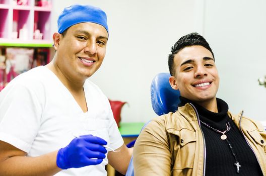 Dentist with patient in clinic smiling, dental care concept