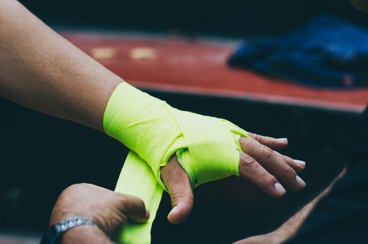 Boxer bandages around their arms ready to fight