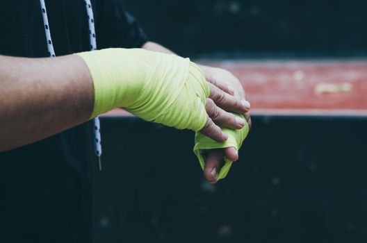 Boxer bandages around their arms ready to fight