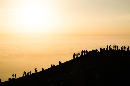 Beautiful sunset view from Apu Siqay with the silhouette of unrecognizable people, located in Villa Maria - Lima - Peru