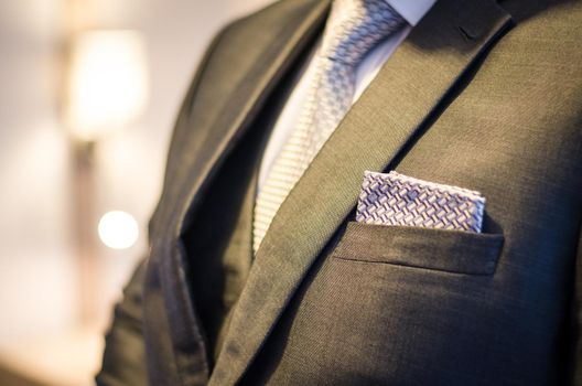 Part of a suit of a businessman with tie and handkerchief