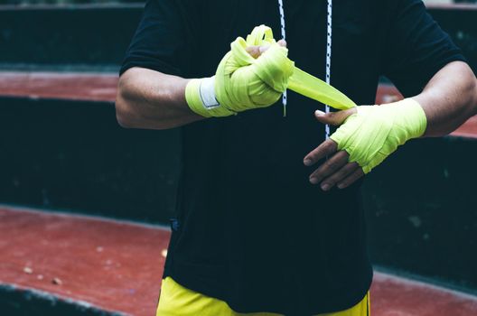 Boxer bandages around their arms ready to fight