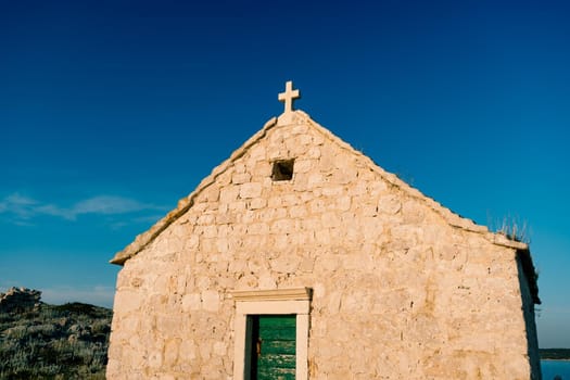 Stone facade of the old Church of St. Ivan at cape Punta Planca. High quality photo