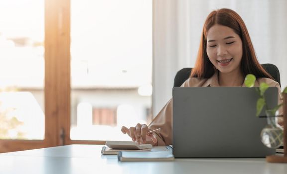 Accountant businesswoman working with calculator for financial document in office. male accountant doing accounting and calculating. bookkeeper making calculation. Savings, finance