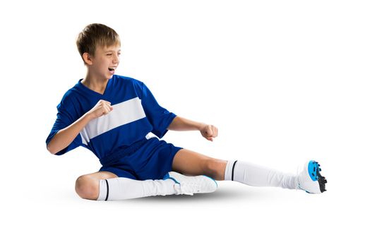 Boy football player in blue uniform against white background