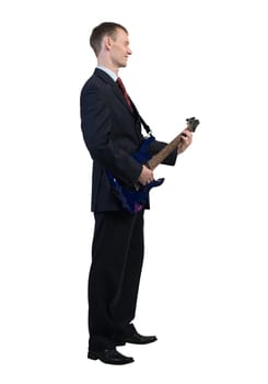Full length of young businessman playing guitar on white background