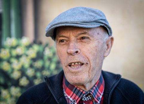 Good looking senior man portrait outdoors in park ,high quality photo