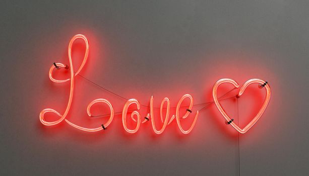 red neon lamp with the word LOVE and a heart on a dark wall. concept of love, valentine, greeting card and decoration. 3d rendering