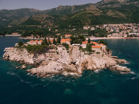 Stone cliff of Sveti Stefan island from the sea side. High quality photo