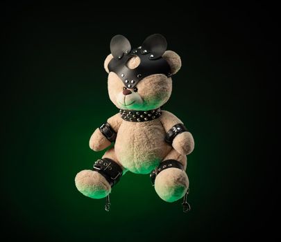 the toy Teddy bear dressed in leather belts and mask accessory for BDSM games