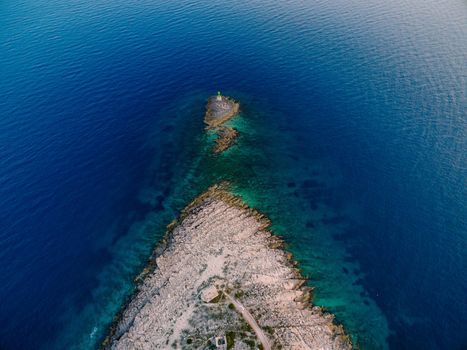 Aerial view of a small island in front of Punta Planca cape. High quality photo