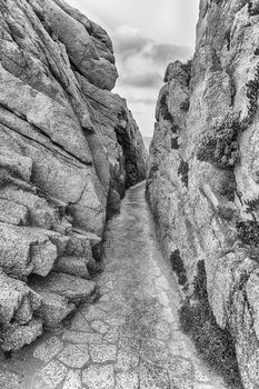 Scenic corridor among granite rocks in Santa Teresa Gallura, northern Sardinia, Italy