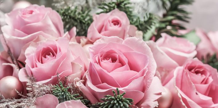 Pink roses with fir branches. Macro flowers background for holiday brand design