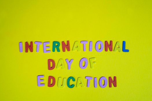 the phrase international day of education formed with colorful letters