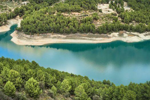 The swamp of Guadalest village surrounded by vegetation and mountains on a sunny day