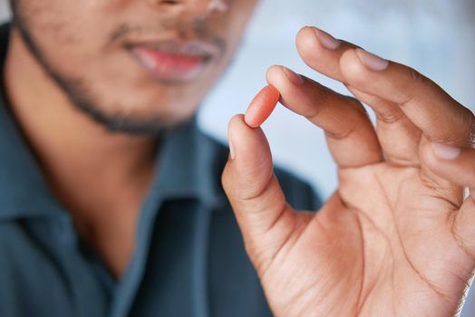 upset man hand holding medical pills .