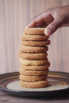 close up of sweet cookies on wooden table .