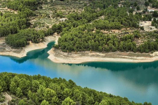 The swamp of Guadalest village surrounded by vegetation and mountains on a sunny day