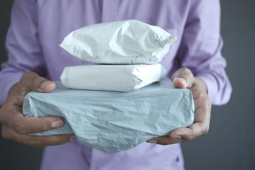 men holding delivery package close up .
