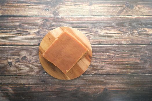 Jaggery traditional cane sugar cube on table .